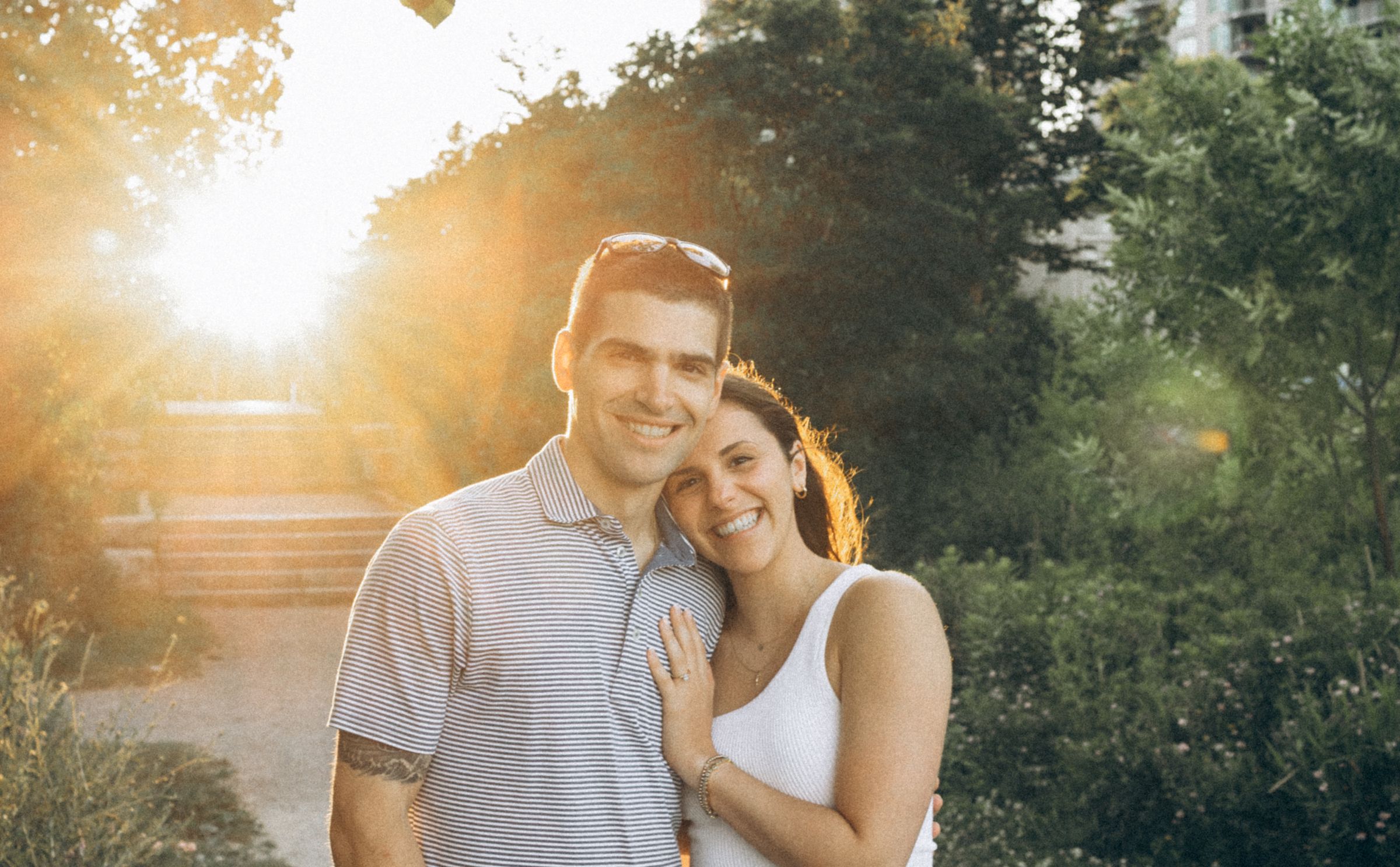 Christina and Matthew laughing together in the golden evening light